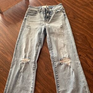 Light blue buckle jeans